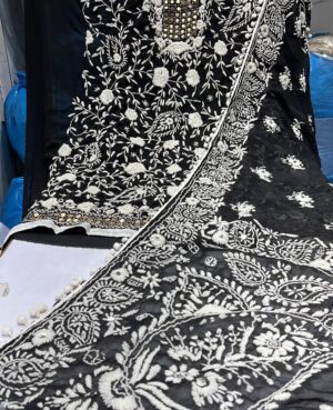 Georgette Semistitched suit in black colour with all  over white embossed chikankari embroidery and goldenflat sequin embellishments on neck,yoke and hemline. Lower-base colour shantoon  Dupatta- georgette Dupatta with all over white embossed chikankari embroidery and flat golden sequins on all sides.