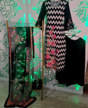 Ready to wear three piece viscose kurta with digital printing. Embellished with sequin embroidery, swarokski and lace on sleeves and hemline.