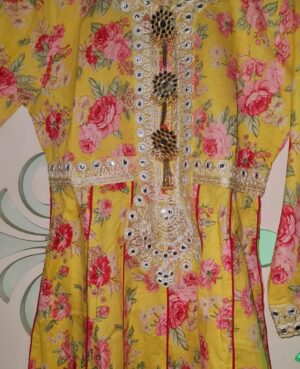 Ready to wear mul floral printed three piece pallazo suit embellished with embroidered patchwork on kurta front,back and sleeves and mirror work kurta patti zanjiri.