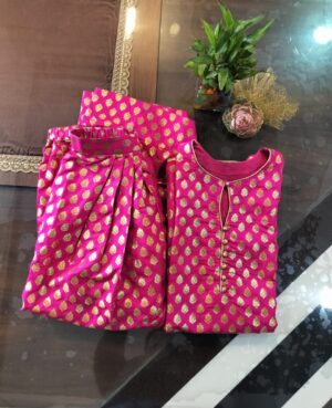 Fuchsia Pink Banarasi Silk Zari Woven All over bootas fabric stitched to perfection into a Farsi Shalwar Suit Set with golden potli button detailing and piping.