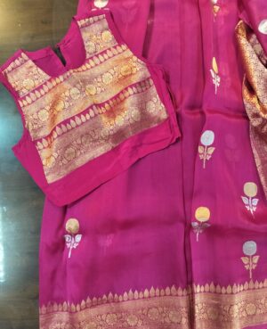 Fuchsia Pink Banarasi Silk Zari Woven All over bootas fabric stitched to perfection into a Farsi Shalwar Suit Set with golden potli button detailing and piping.